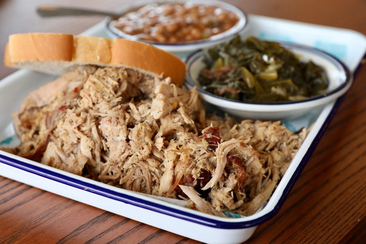 Pulled port with collard greens and baked beans at Rodney Scott’s Whole Hog BBQ.